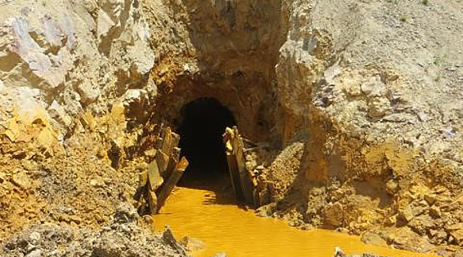 Yellow mine waste water is seen at the entrance to the Gold King Mine in San Juan County, Colorado