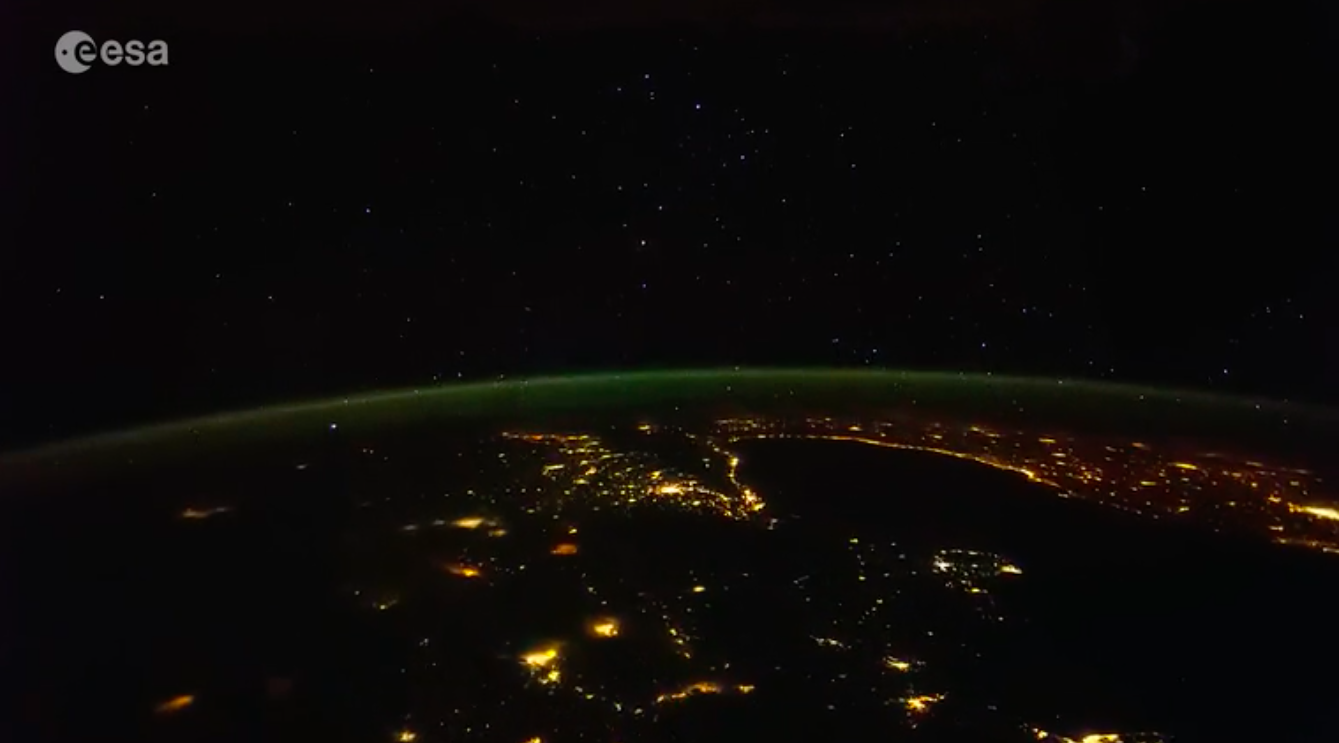 Stars and city lights on Earth at night