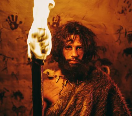 Portrait,Of,Primeval,Caveman,Wearing,Animal,Skin,Standing,In,His