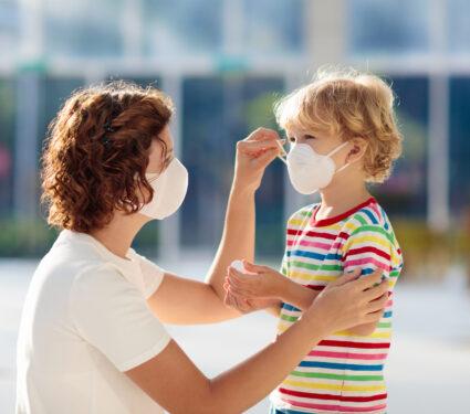 Family,With,Kids,In,Face,Mask,In,Shopping,Mall,Or