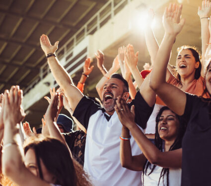 Crowd,Of,Sports,Fans,Cheering,During,A,Match,In,Stadium.