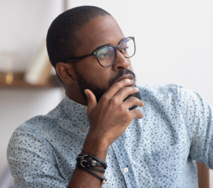 Pensive,African,American,Businessman,Pondering,Business,Strategy,,Serious,Employee,Thinking