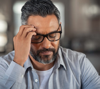 Frustrated,Middle,Aged,Man,Sitting,On,Couch,At,Home.,Close
