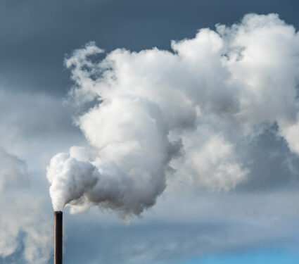 Pollution,From,An,Industry,Chimney,Blowing,A,Large,White,And