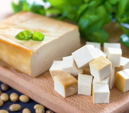 Smoked,Soy,Cheese,Tofu,Diced,On,A,Cutting,Board,,Soy