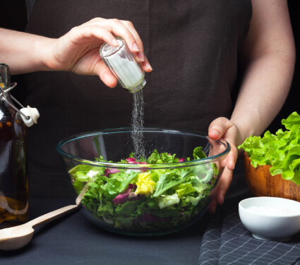 Woman,Chef,In,The,Kitchen,Preparing,Vegetable,Salad.,Healthy,Eating.
