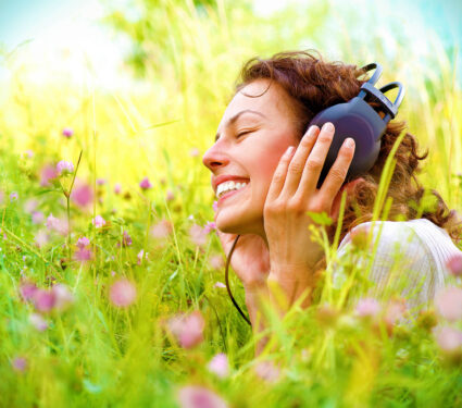 Beautiful,Young,Woman,With,Headphones,Outdoors.,Enjoying,Music