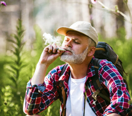 Bearded,Mature,Man,Smoking,Medical,Marijuana,In,Nature.