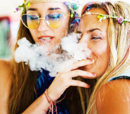 Two,Women,Sisters,Or,Friends,Sharing,A,Smoke,Or,Joint