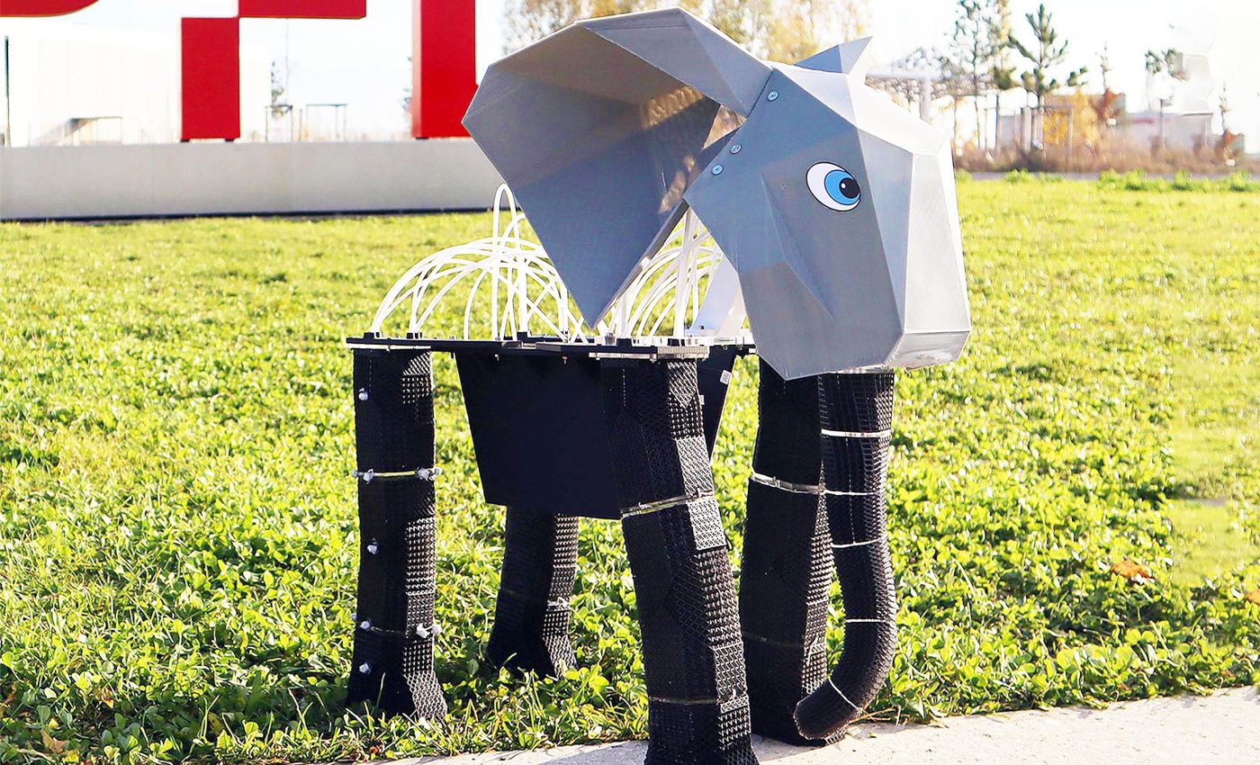 Elephant robot named 'EleBot' lifts weights and picks flowers with a foam trunk