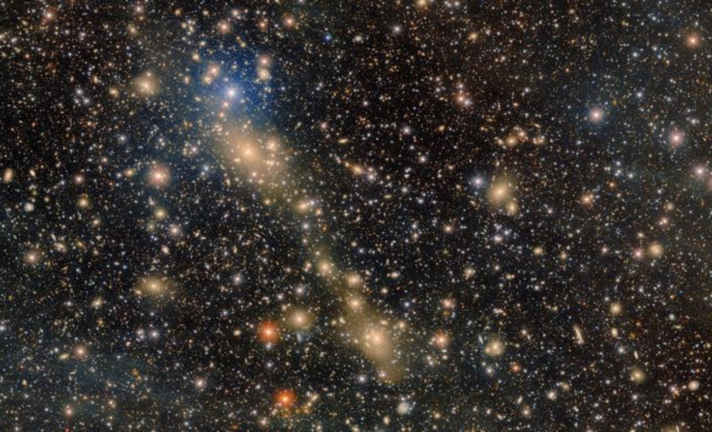 Faint glow reveals galaxies merging in deep space